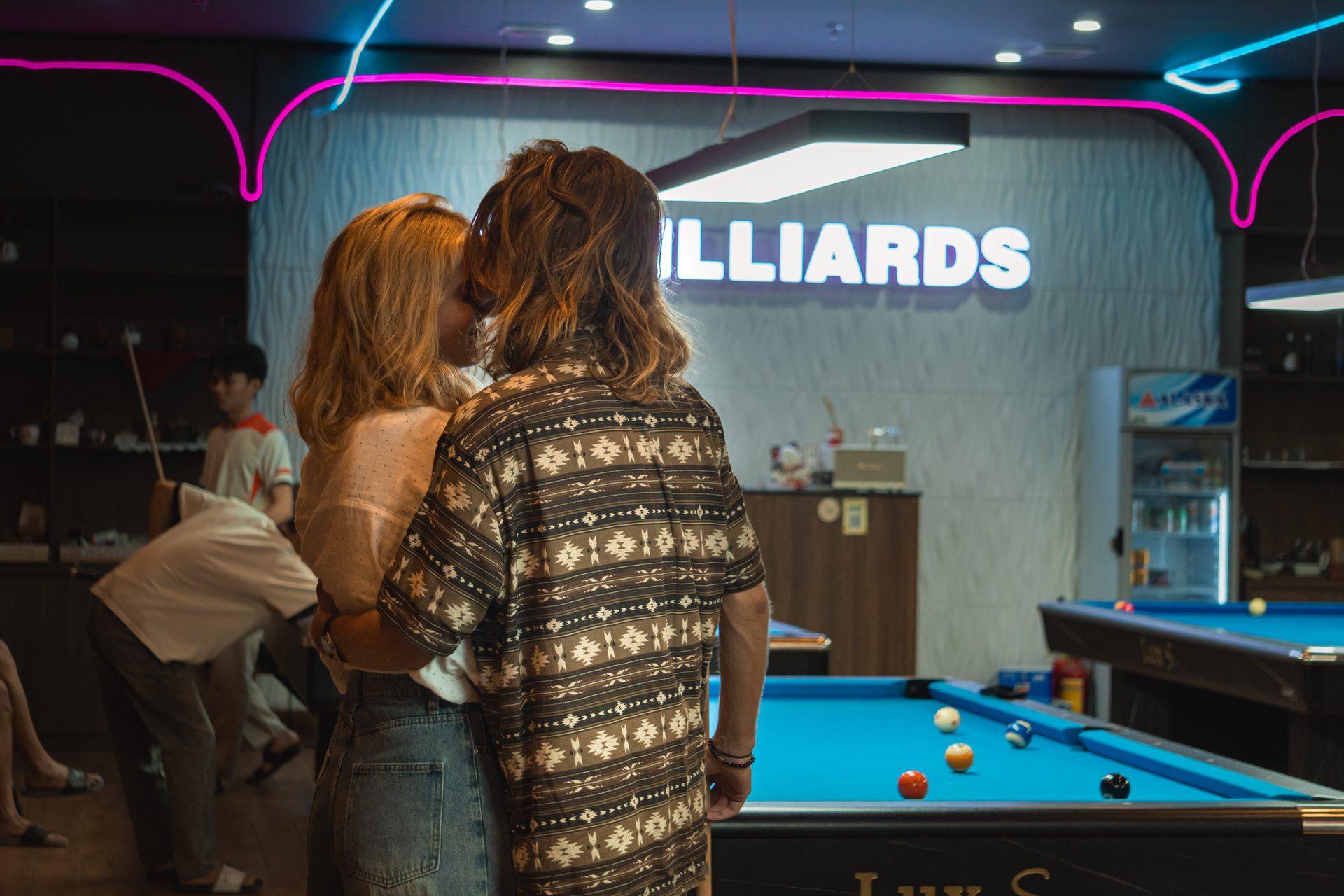 Regulars together under the 92 Billiards sign