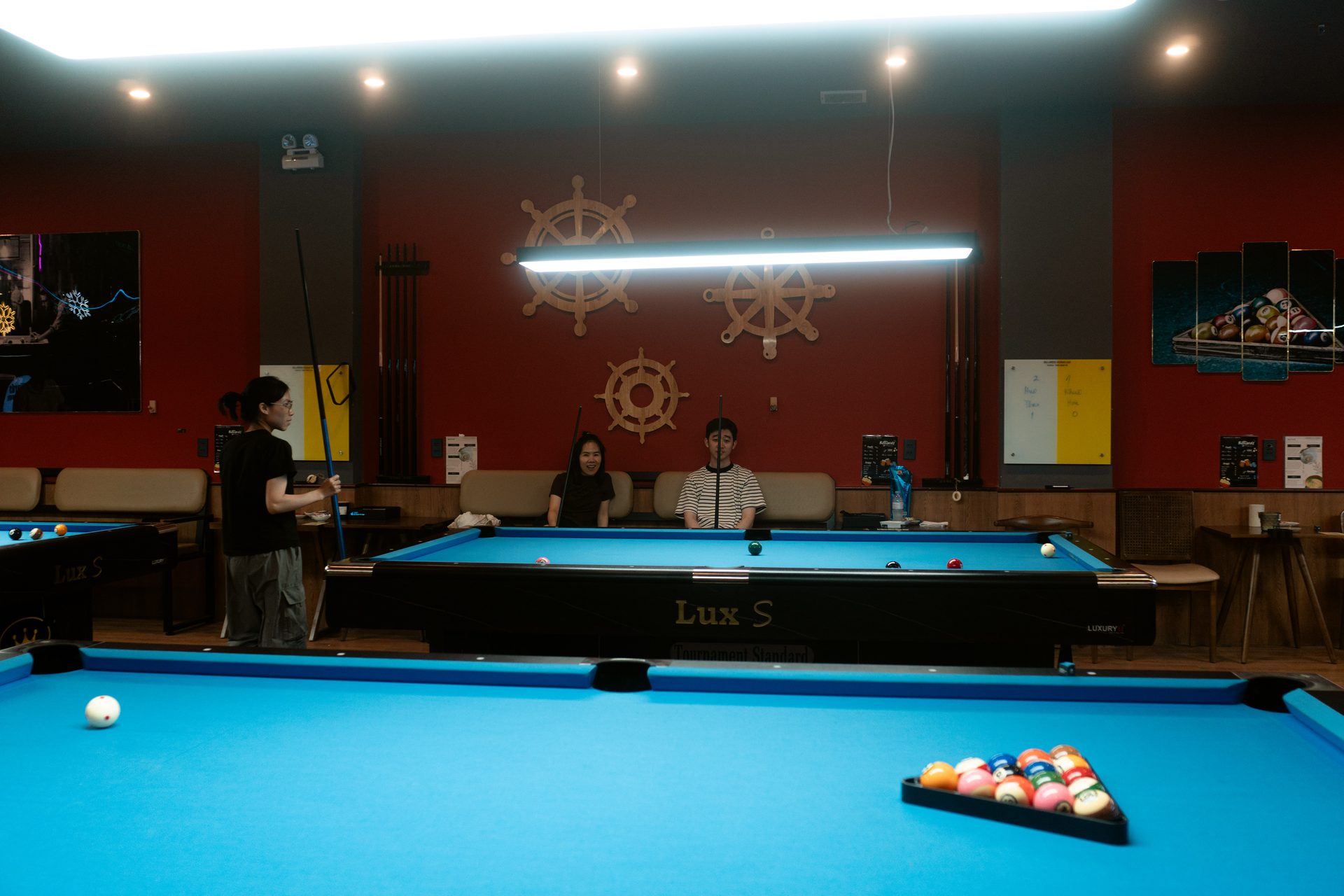 A busy night with every table in play at 92 Billiards Club