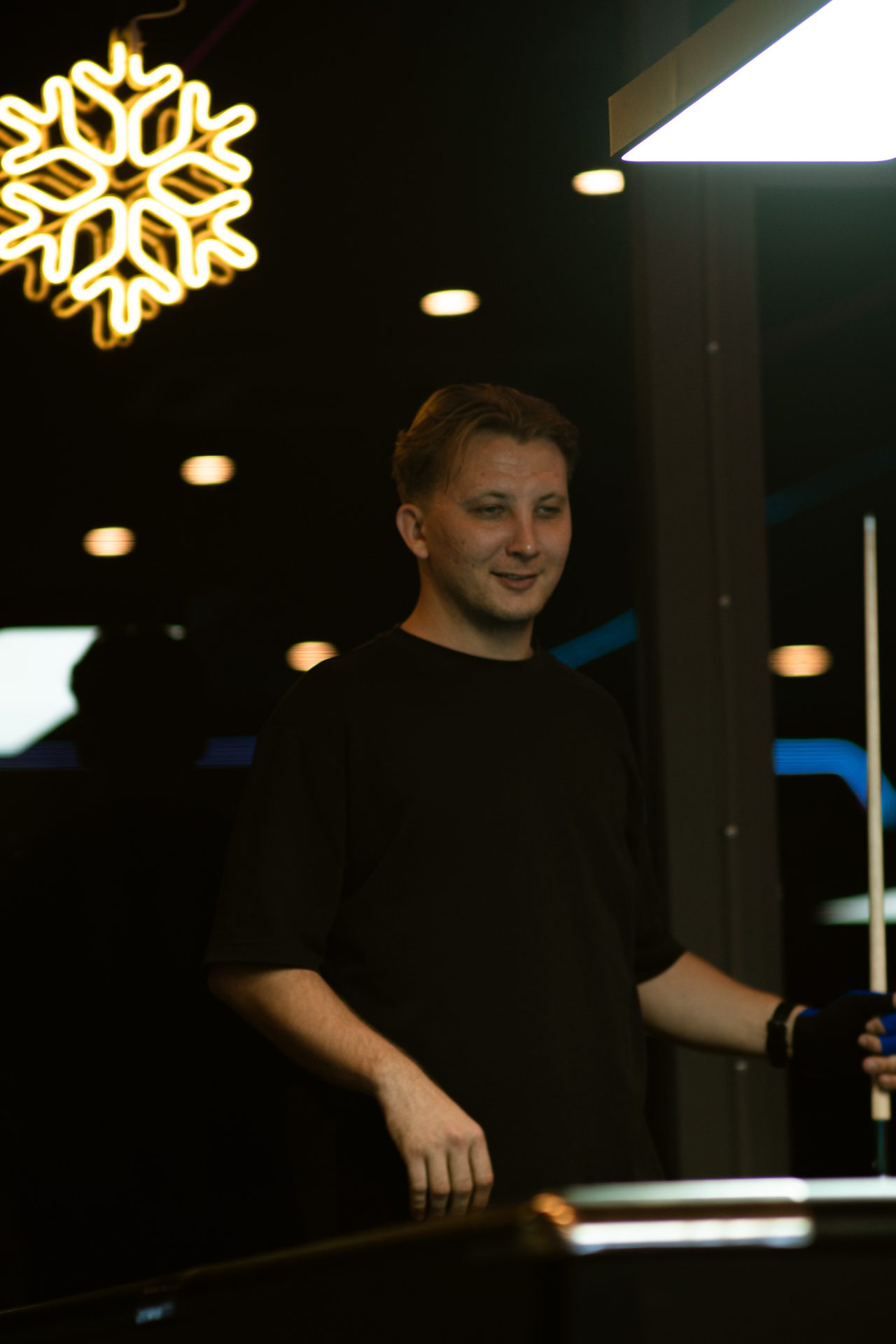 A player taking a shot at 92 Billiards Club