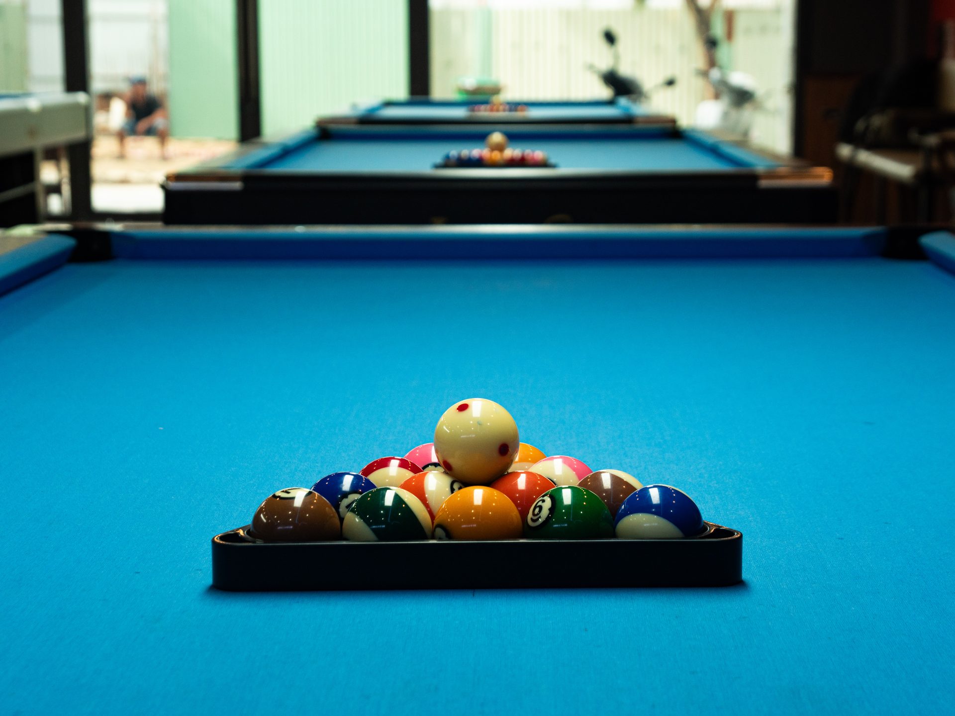A fresh rack on the Lux S tournament-standard cloth at 92 Billiards Club